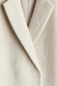 Manteau à fermeture croisée