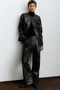 Pantalon en tissu enduit