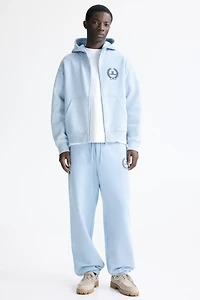 Veste carré ample à capuche et fermeture éclair