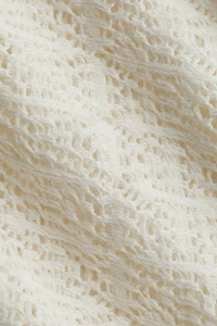 Haut en tricot façon dentelle