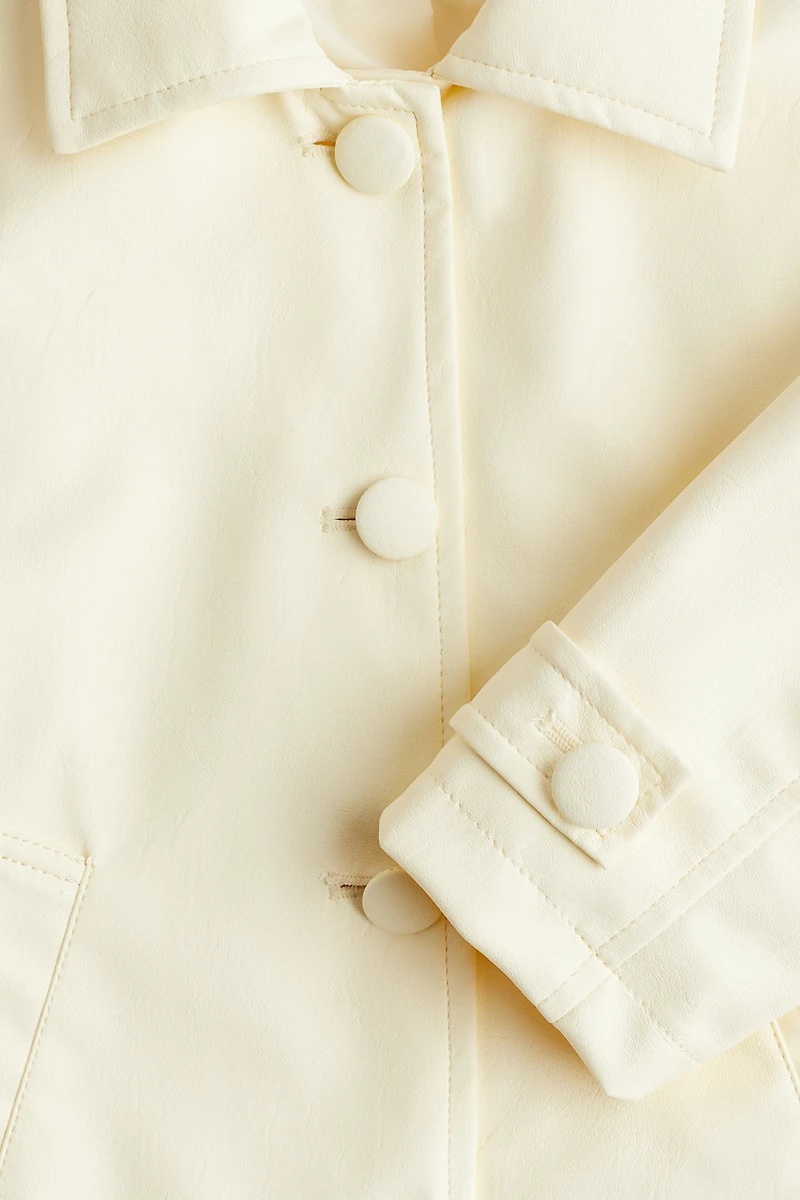 Manteau en tissu enduit