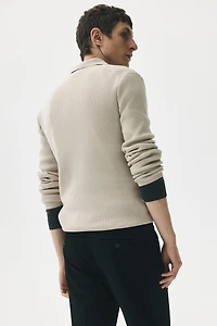 Polo près du corps en tricot côtelé