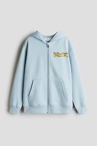 Veste à capuchon fermeture éclair avec motifs