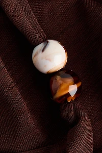 Haut à effet drapé avec perles de fantaisie