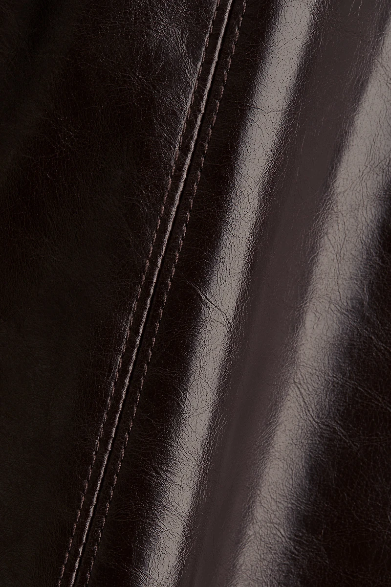 Jupe corolle en tissu enduit