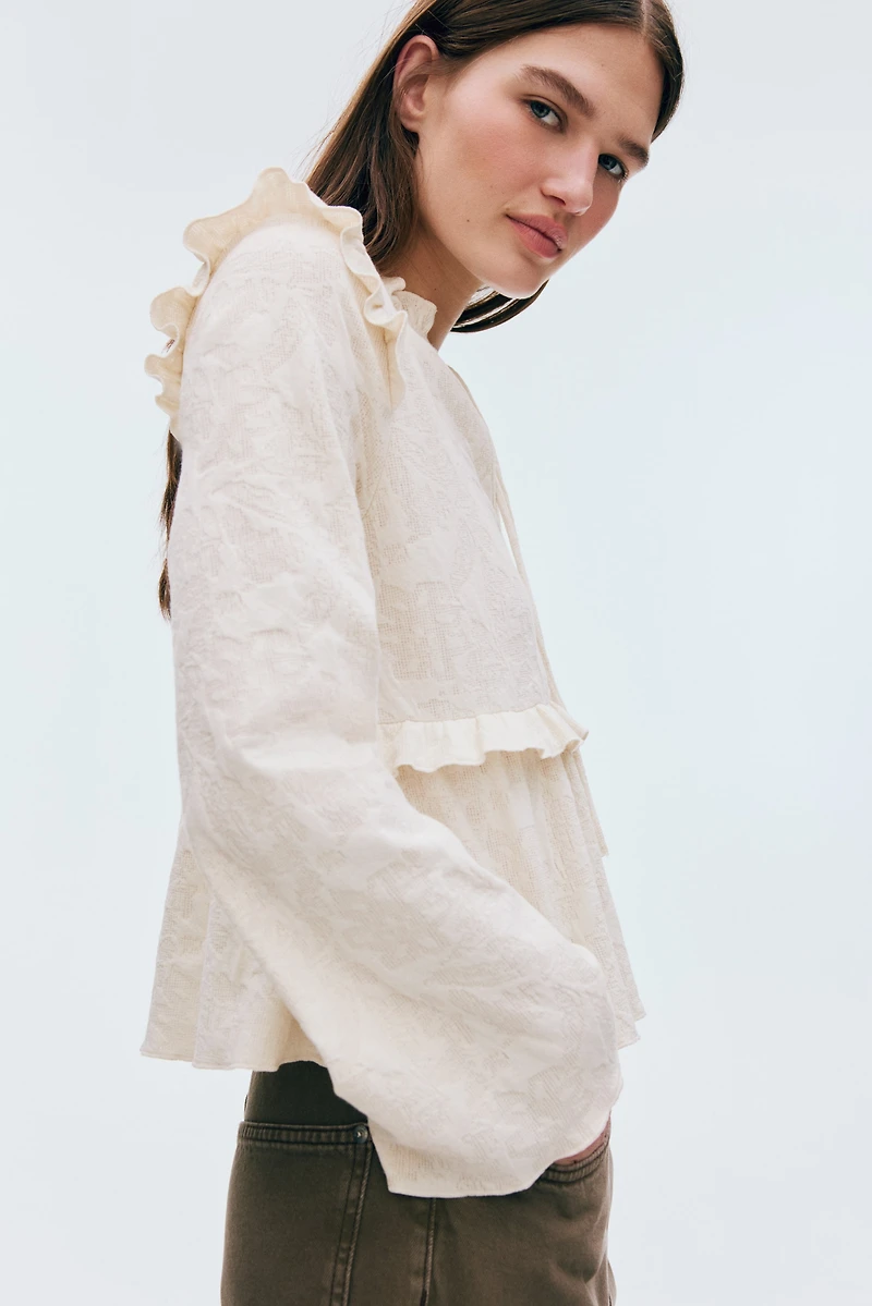 Blouse en jersey jacquard