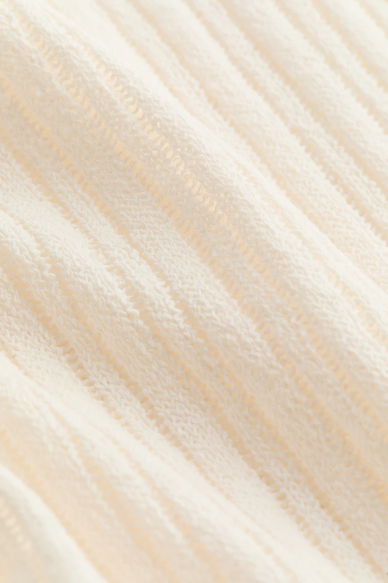 Cape en tricot côtelé