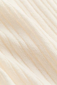 Cape en tricot côtelé