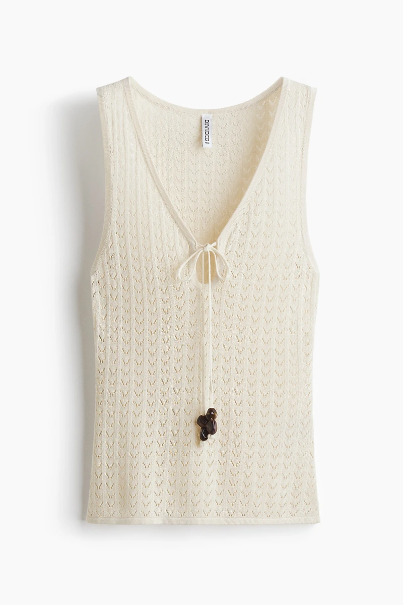 Haut en tricot pointelle avec liens à nouer