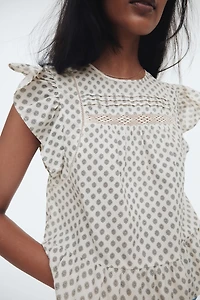 Blouse péplum avec dentelle