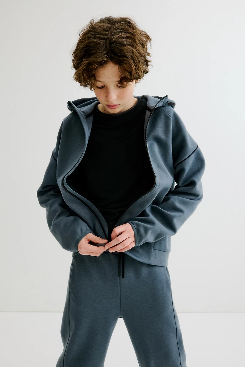 Veste sport fermeture éclair et capuche DryMove™