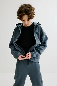 Veste sport fermeture éclair et capuche DryMove™