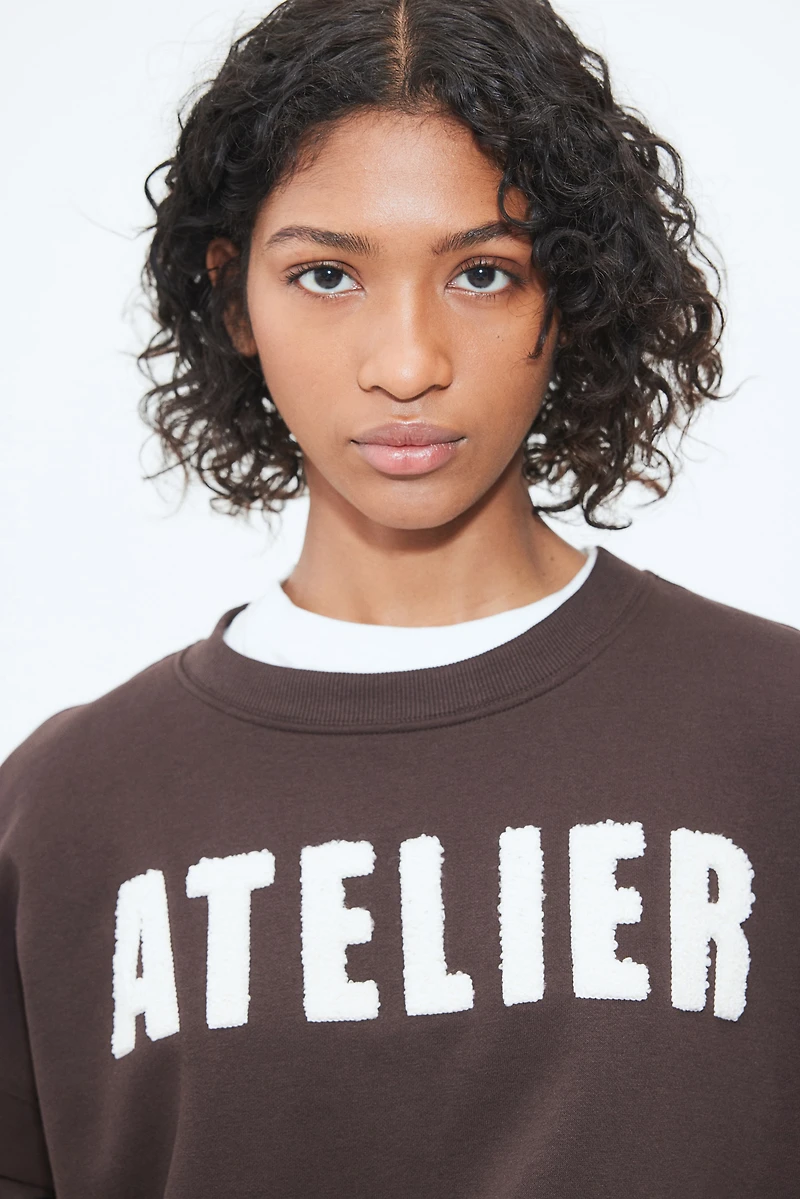 Sweatshirt with Text Motif