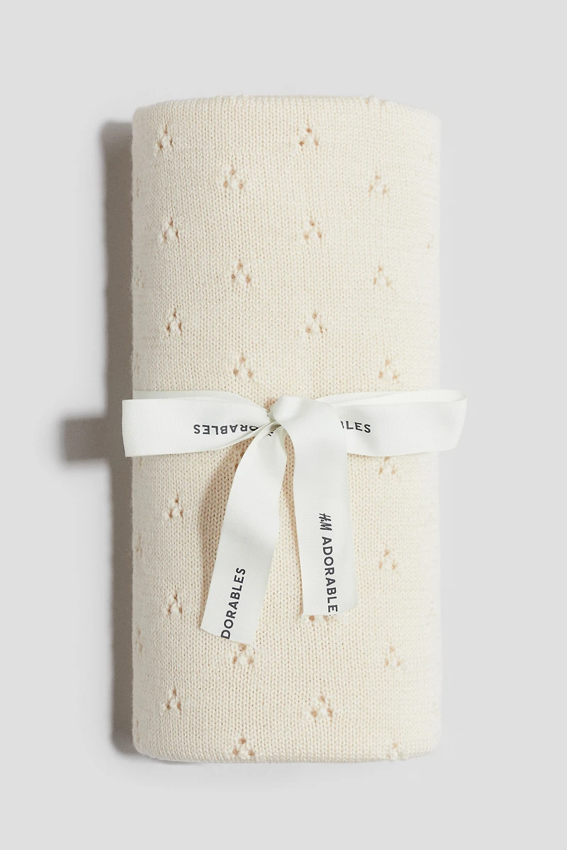 Couverture en tricot pointelle de laine