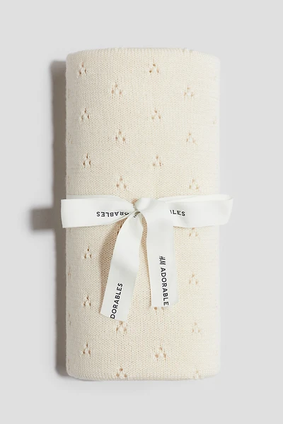 Couverture en tricot pointelle de laine