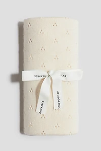 Couverture en tricot pointelle de laine