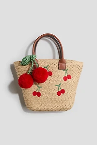 Sac en paille avec appliqué