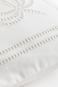 Housse de coussin avec broderie anglaise