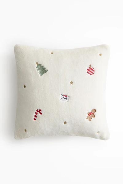 Housse de coussin brodée