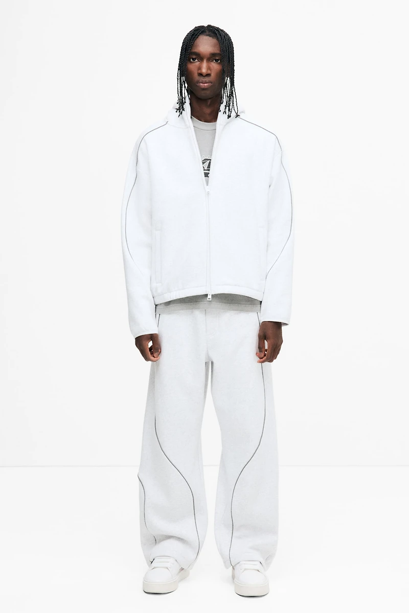 Veste à fermeture éclair ample avec capuchon