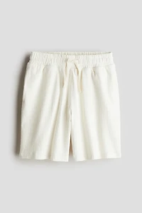 Short en tricot texturée