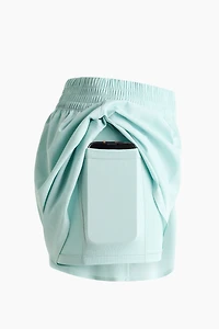 Short de sport superposé avec poche