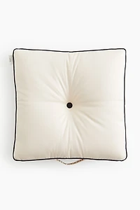 Coussin avec passepoil
