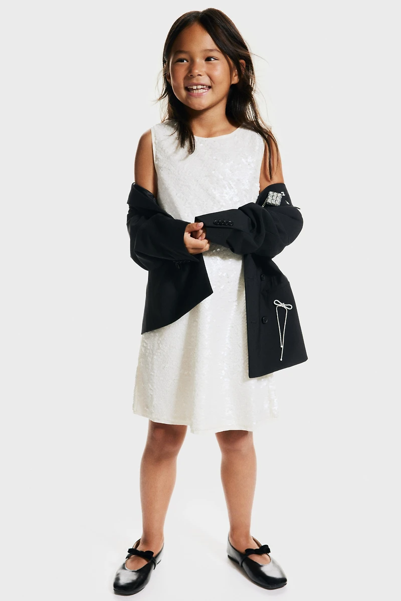 Robe à sequins avec grande boucle