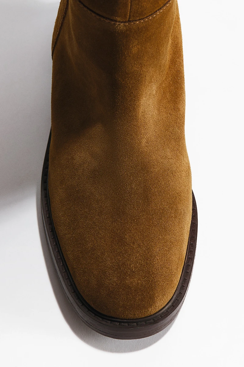 Bottes au genou en cuir velours fendu