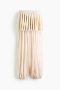 Pantalon en filet avec jupe superposée