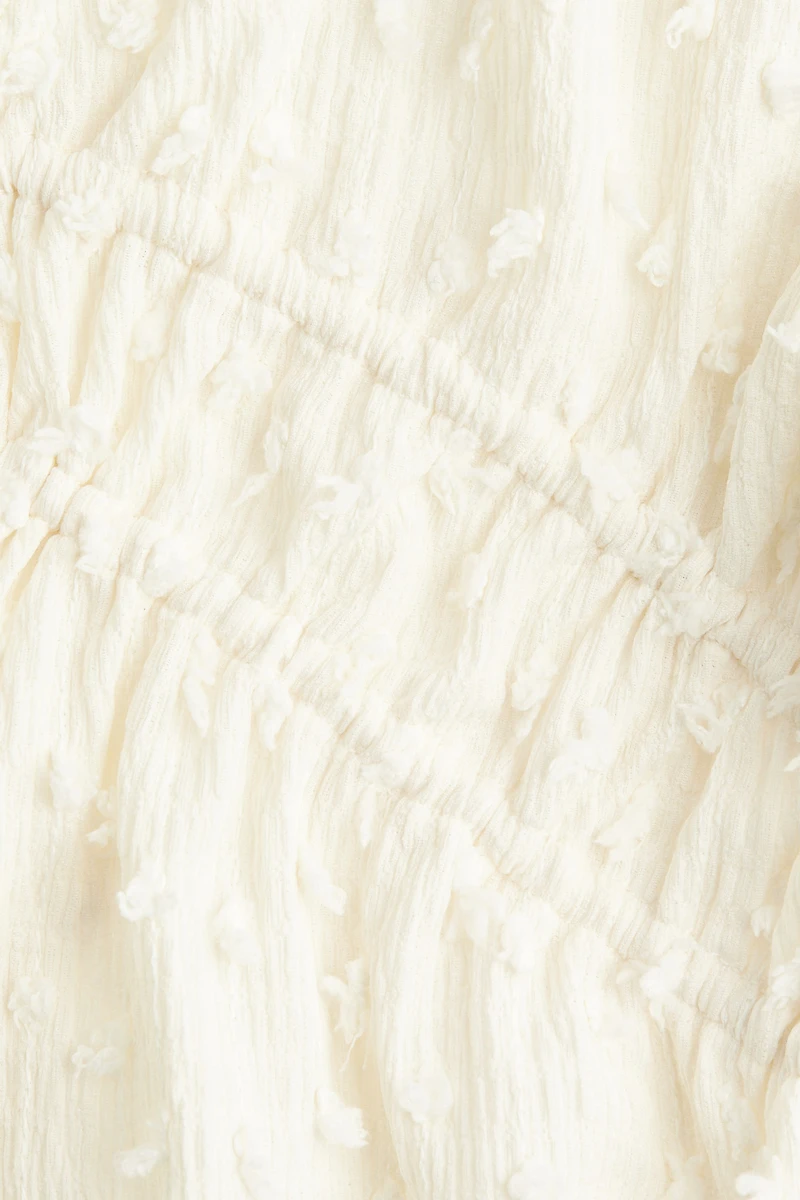 Haut en plumetis avec liens à nouer