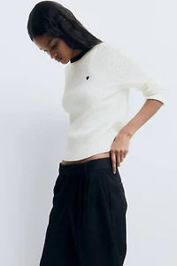 Chandail en tricot torsadé