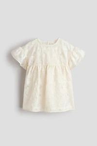 Robe à manches volantées avec broderies