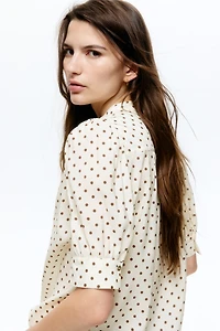 Blouse à manches bouffantes