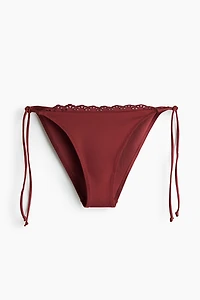 Bas de maillot échancré Tanga à nouer