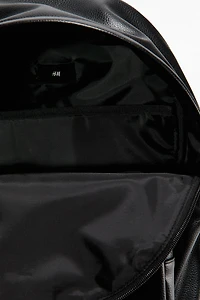 Sac à dos en tissu enduit