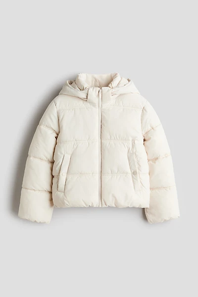 Manteau court matelassé à capuche