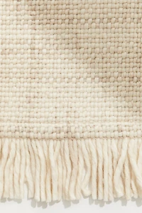 Tapis frangé en laine mélangée