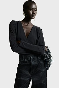 Maillot string drapé à encolure en V