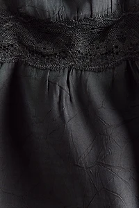 Haut péplum avec dentelle