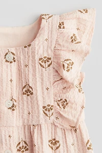 Ruffle-Trimmed Muslin Romper Suit