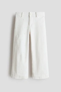 Pantalon évasé avec perles de fantaisie