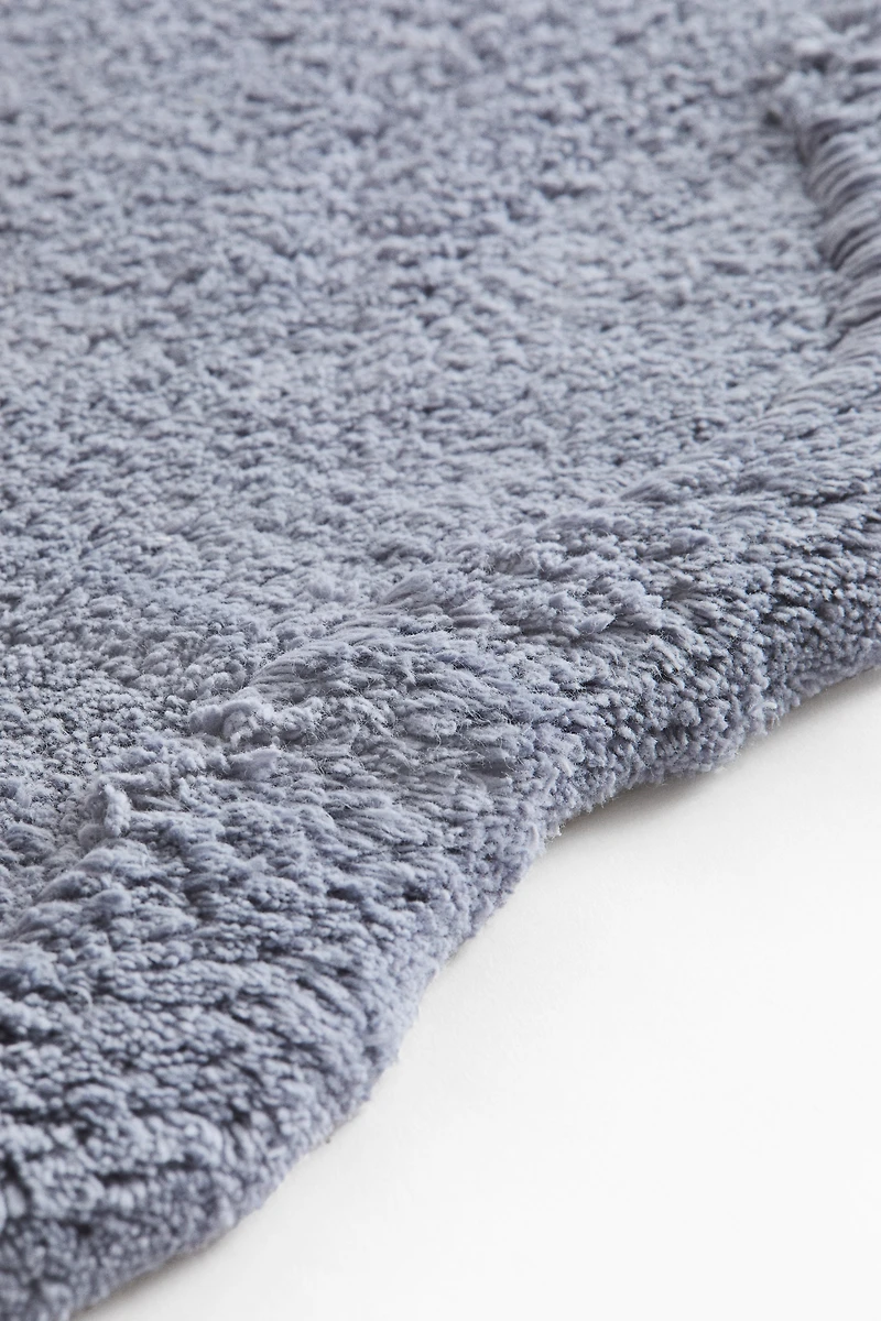 Tapis de bain en coton touffeté