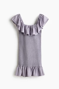 Robe épaules nues à volants