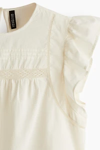 Lace-Inset Peplum Blouse
