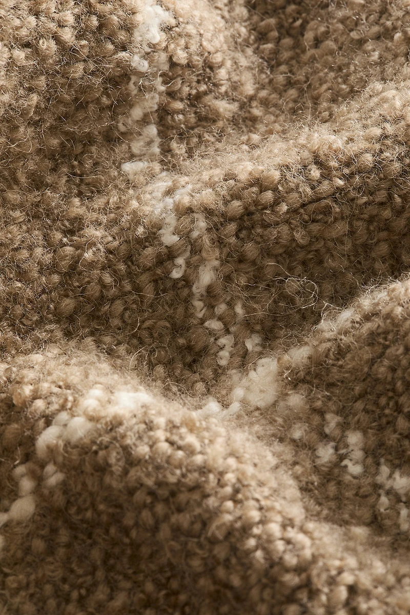 Housse de coussin en laine bouclée mélangée
