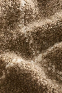 Housse de coussin en laine bouclée mélangée