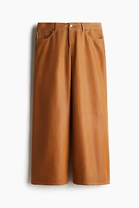 Pantalon large en tissu enduit