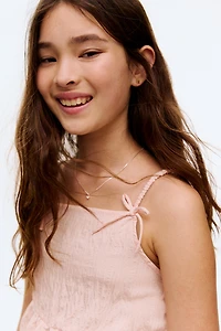 Bow-Detail Peplum Top