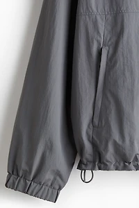 Veste coupe-vent à capuche